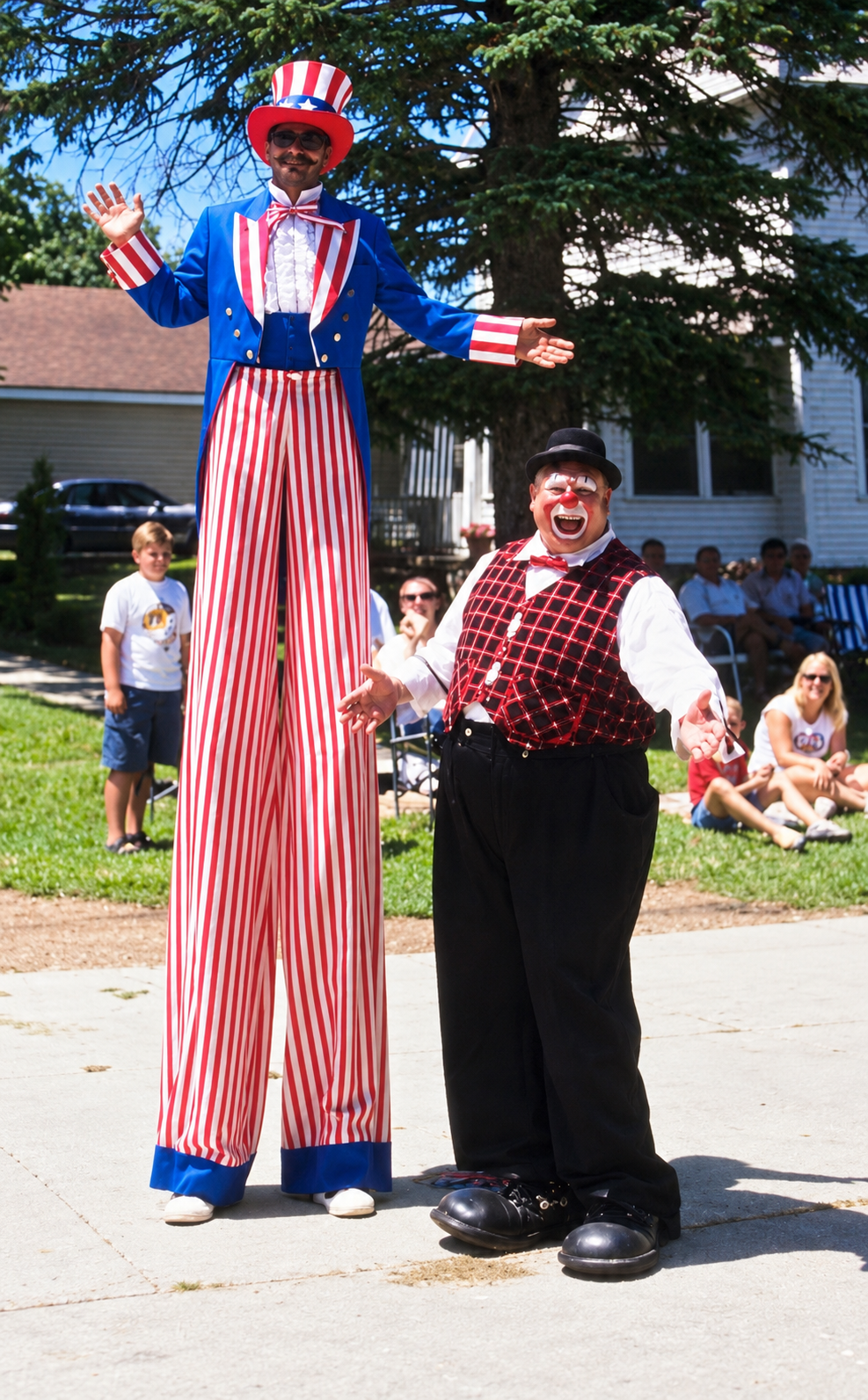 Uncle Sam stilt walker with clown at outdoor event
